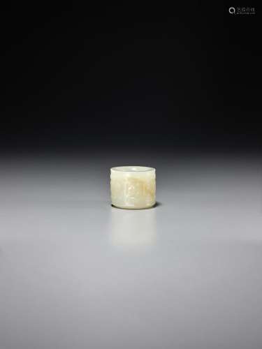 A CARVED WHITE JADE ARCHER'S RING 18th century