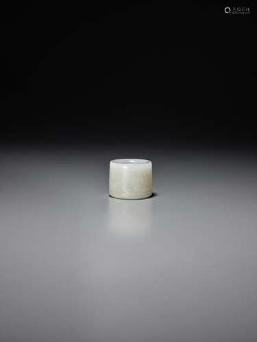 A PIERCED AND CARVED WHITE JADE ARCHER'S RING 18th centu...