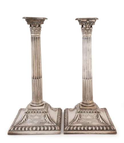 A pair of Georgian sterling silver Corinthian column candles...