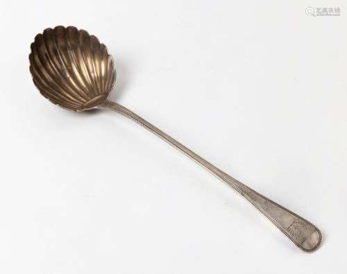 A Georgian sterling silver ladle with shell-shaped bowl, bea...