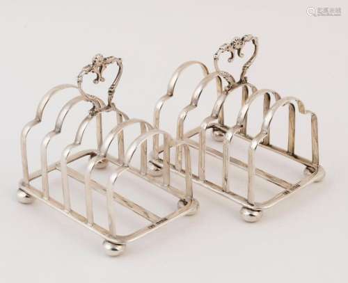 A pair of English sterling silver toast racks by Atkins Brot...