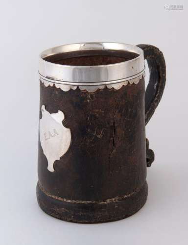 A vintage leather pint tankard with sterling silver mounts b...