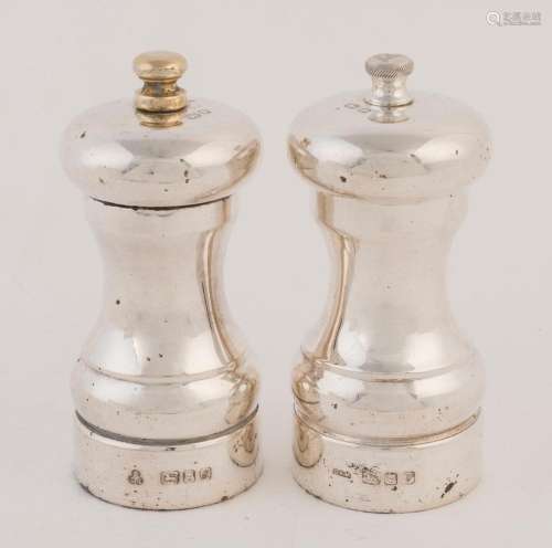 A pair of English sterling silver pepper mills, 20th century...