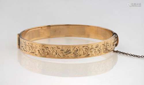 An antique 9ct rolled gold bangle with engraved decoration, ...