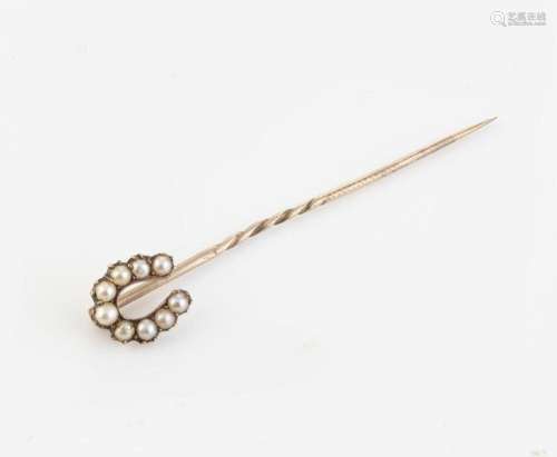 An antique yellow gold horseshoe stickpin set with seed pear...