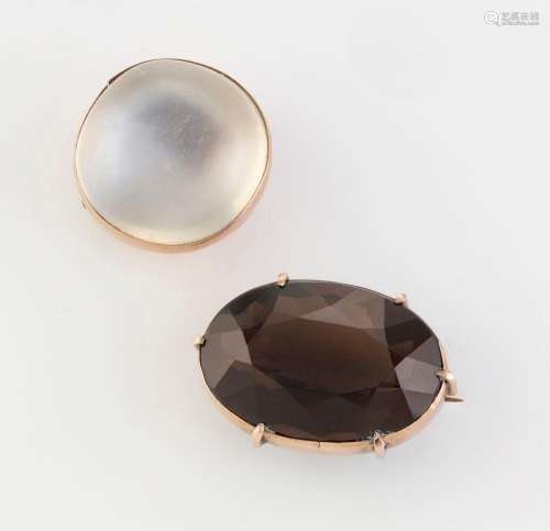 Two antique rose gold brooches set with a cut topaz and a ca...