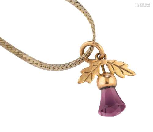 A 9ct yellow gold thistle pendant set with an amethyst, on a...