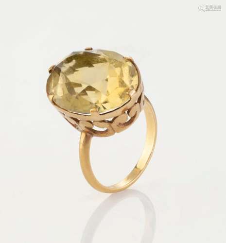 A yellow gold ring set with a large yellow topaz, 20th centu...