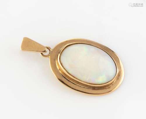 A 9ct yellow gold pendant set with a solid white opal, circa...