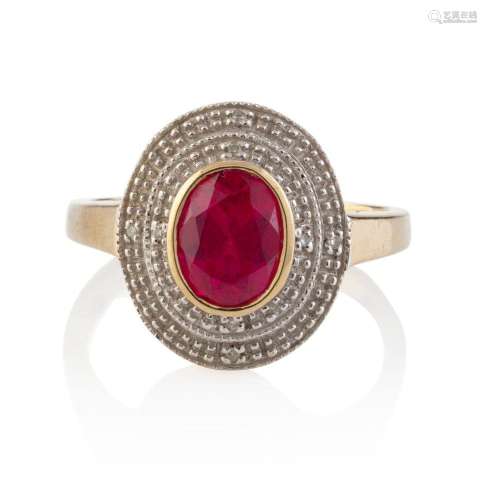 A 9ct yellow gold ring set with red stone in white gold oval...