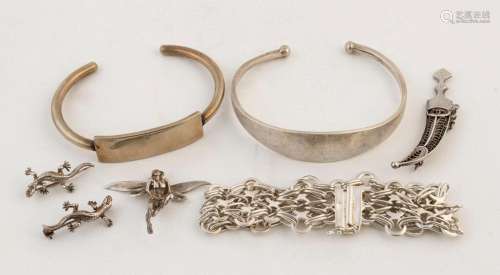 Two silver bangles, a silver bracelet, a silver fairy orname...