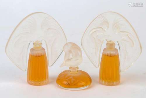 LALIQUE group of three French perfume bottles, glass and pla...