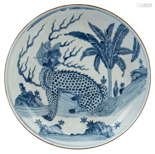A Chinese blue and white charger with foo dog in landscape d...