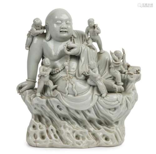 Blanc de chine Chinese porcelain statue of a Buddha surround...