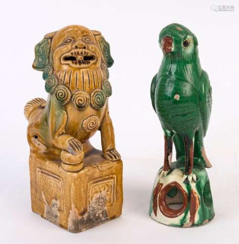 An antique Chinese pottery lion statue together with a green...