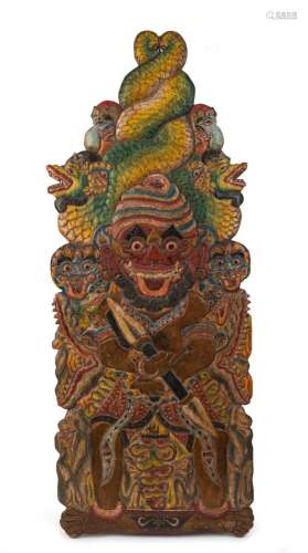 A Balinese carved timber plaque with polychrome finish, 19th...