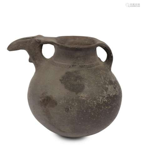 A libation vessel, burnished black earthenware with zoomorph...