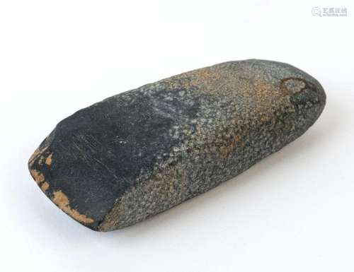 A Neolithic axe head, ground and polished basalt. Together w...