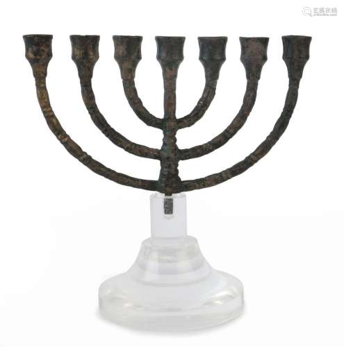A bronze Menorah lamp stand of classic form with six curved ...
