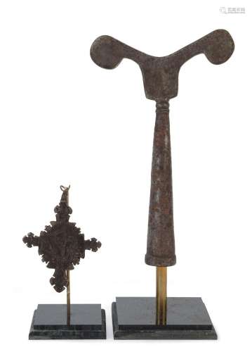 Two Ethiopian religious items, one being an iron cross engra...