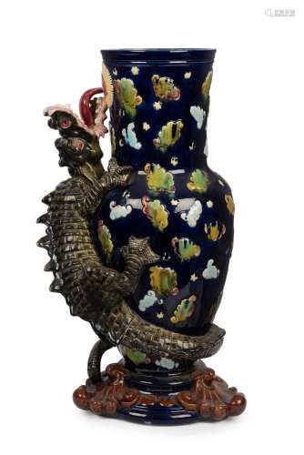An antique French majolica dragon vase of impressive proport...