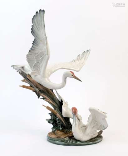 LLADRO Spanish porcelain figural crane group, A/F, blue fact...