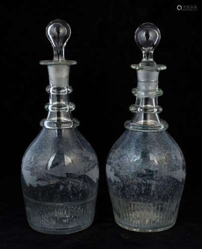 A pair of Georgian glass decanters with etched decoration, 1...