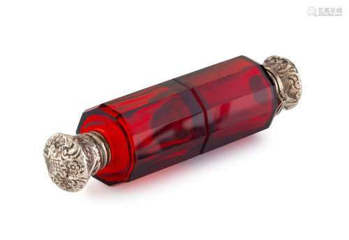 An antique ruby double-ended scent bottle with silver tops, ...