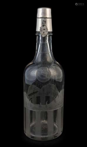 An antique decanter with fine wheel-cut decoration and silve...