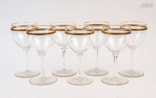 Set of seven vintage wine glasses with gilt decoration, earl...