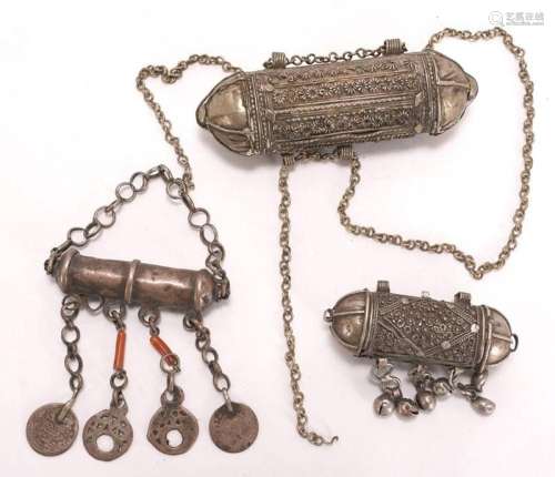 Three amulet pendants