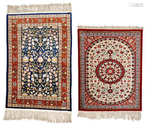 One Signed silk Hereke and one Silk Ghom Rug