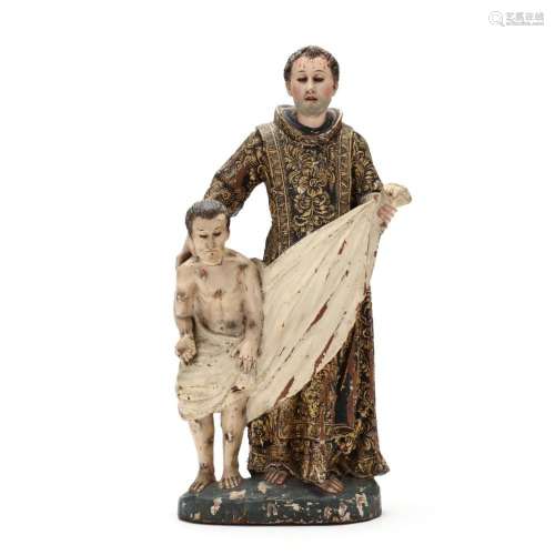 A Spanish Colonial Santos Figural of a Saint Tending the Aff...