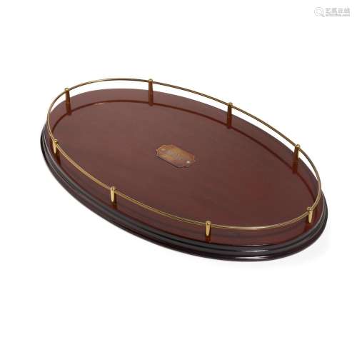 A MARTIN GINSBURG MONOGRAMMED OVAL TRAY. Mahogany with brass...