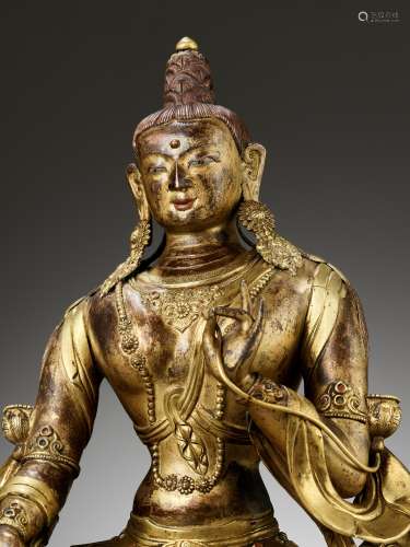 A CAST AND REPOUSSE GILT COPPER ALLOY FIGURE OF GREEN TARA, ...