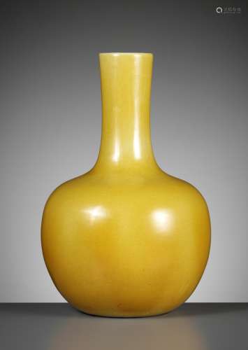 A MONOCHROME YELLOW-GLAZED BOTTLE VASE, TIANQIUPING, QING DY...