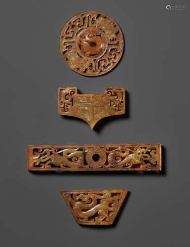 A RARE AND COMPLETE SET OF FOUR JADE OPENWORK SWORD FITTINGS...