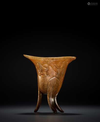 A RHINOCEROS HORN ARCHAISTIC LIBATION CUP, JUE, EARLY QING D...