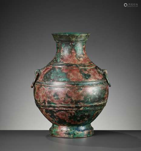 A COPPER INLAID BRONZE RITUAL WINE VESSEL, HU, WESTERN HAN D...