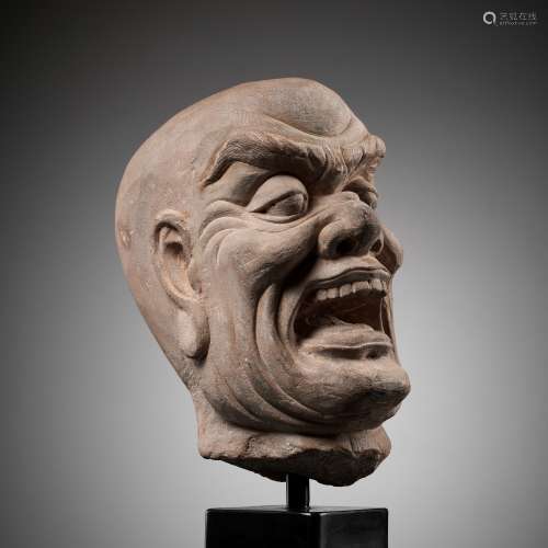 A RED SANDSTONE HEAD OF A LOKAPALA, SONG TO MING DYNASTY