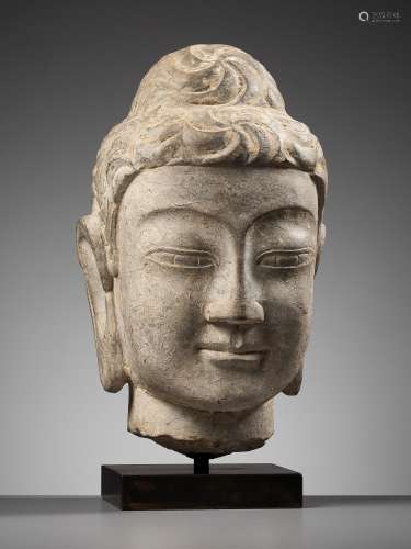 AN EXCEPTIONAL LIMESTONE HEAD OF BUDDHA, NORTHERN QI DYNASTY