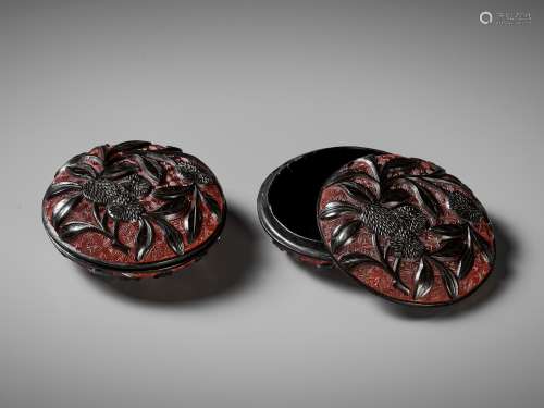 A PAIR OF RED AND BLACK LACQUER 'LYCHEE' BOXES AND COVERS, M...