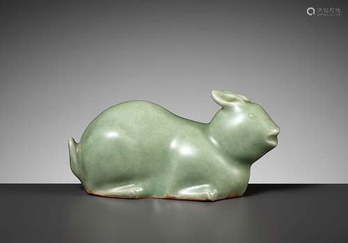 A LONGQUAN CELADON FIGURE OF A RECUMBENT RABBIT, LATE MING D...