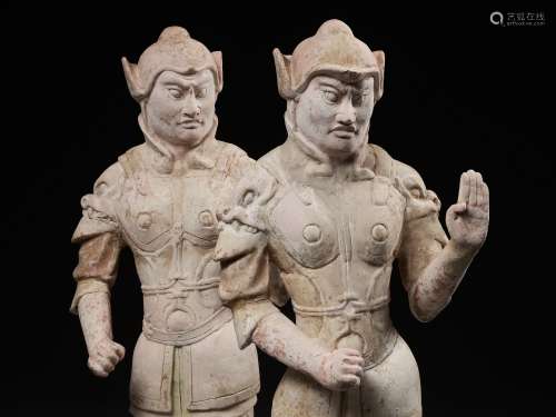 A PAIR OF LARGE POTTERY GUARDIAN FIGURES, WUSHIYONG, TANG DY...