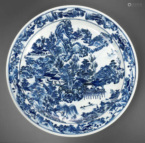 A MONUMENTAL BLUE AND WHITE 'LANDSCAPE' CHARGER, KANGXI PERI...