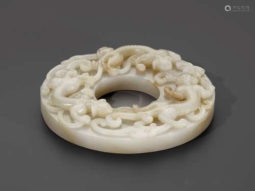 A PALE CELADON AND RUSSET JADE 'CHILONG' DISC, BI, QING DYNA...