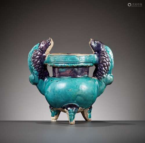 A FAHUA 'DOUBLE FISH' TRIPOD CENSER, MING DYNASTY