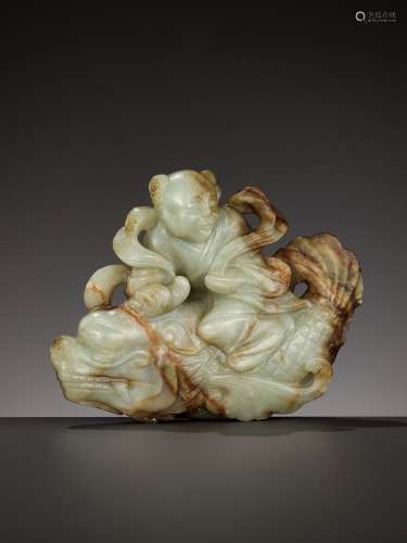 A CELADON AND RUSSET JADE FIGURE OF A BOY RIDING A DRAGON-CA...
