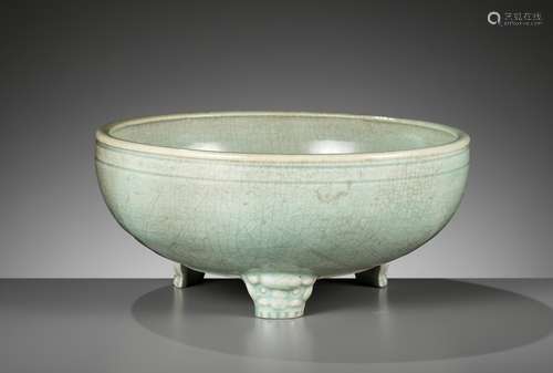 A CARVED AND MOLDED LONGQUAN CELADON TRIPOD CENSER, MING DYN...