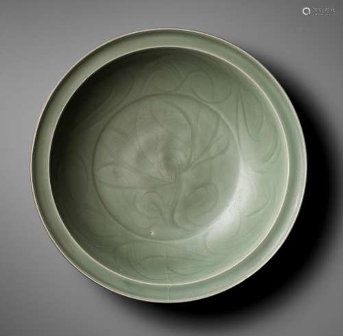 A CARVED LONGQUAN CELADON 'LOTUS' CHARGER, MING DYNASTY